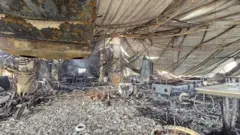 পুড়ে যাওয়া ক্লাবের চিত্র