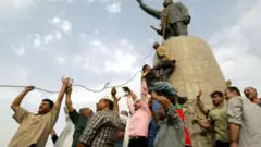 إزالة تمثال صدام حسين
