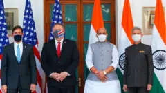 US Secretary of State Mike Pompeo (2nd L), US Secretary of Defence Mark Esper (L), India's Defence Minister Rajnath Singh (2nd R) and India's Foreign Minister Subrahmanyam Jaishankar pose for pictures before their meeting at Hyderabad House in New Delhi on October 27, 2020.