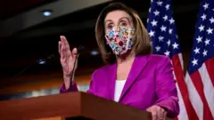 Nancy Pelosi speaks to reporters a day after supporters of US President Donald Trump occupied the Capitol