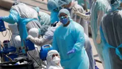 First responders evacuate sick crew members