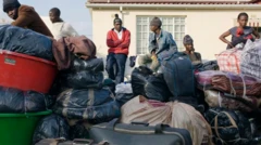 Africans waiting wit dia luggages packed to evacuate from South Africa sake of xenophobic attacks from di kontri.