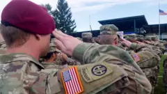 US soldiers saluting