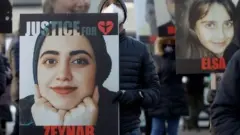 Images of the victims were displayed during an event marking the first anniversary of the tragedy in Toronto last year