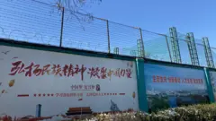 The outside of the Qingdao Taekwang Shoes Co. factory, where Uighur workers make shoes