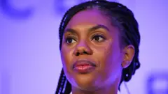 Kemi Kemi Badenoch  na di leader of Conservative Party for UK
