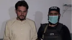 Muhammad Aslam in police custody, 20 May, 2020