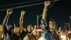 Anti-racism protesters condemned the shooting of black man Jacob Blake on Sunday