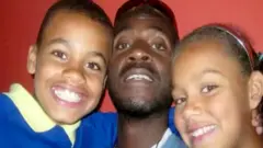 Garvey and Essence with their dad
