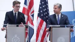 MI5 head Ken McCallum (left) and FBI director Christopher Wray (right) made an unprecedented joint appearance in London