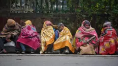 People wearing warm clothes on a cold winter day 