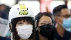 A protester at Hong Kong airport, 9 August 2019