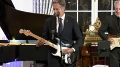 Antony Blinken sings the blues