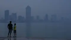 People look at the city of Colombo during the smog and decreased air quality in Colombo, Sri Lanka, on January 29, 2025.