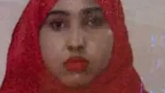 Woman in red head scarf