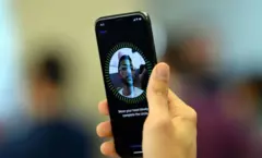 The first buyer of an iPhone X, Mazen Kourouche, takes a selfie inside an Apple showroom in Sydney on November 3, 2017. Apple iPhone X went for sale in Australia with long queues outside the Apple stores. / AFP PHOTO / SAEED KHAN (Photo credit should read SAEED KHAN/AFP via Getty Images)
