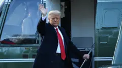 Donald Trump leaves the White House