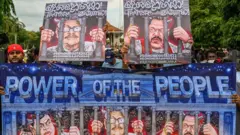Protesters take part in an anti-government demonstration in Colombo on April 30, 2022, demanding President Gotabaya Rajapaksas resignation over the country's crippling economic crisis. (Photo by ISHARA S. KODIKARA