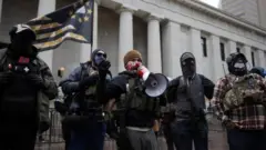Militia groups gather to protect protesters as supporters of President Donald Trump protest against the election of President-elect Joe Biden, outside the Ohio State Capitol in Columbus