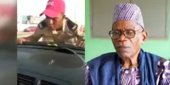 Alagba Salawu pẹlu aworan oṣiṣẹ FRSC kan to n so mọ ọkọ.