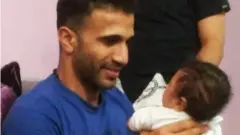 जेल जाने से पहले अपने भतीजे को गोद में उठाए हुए खय्यात