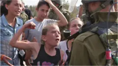 Ukrainian girl confronting a Russian soldier