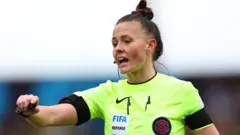 Rebecca Welch refereeing match