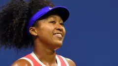 Naomi Osaka smiles after winning US Open semi-final