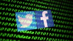 Les logos de Twitter et Facebook sont affichés avec les cyber-codes binaires