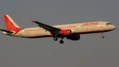 An Air India passenger flight prepares for landing to the Biju Patnaik International Airport in the eastern Indian state odisha's capital city Bhubaneswar (Photo by STR/NurPhoto via Getty Images)