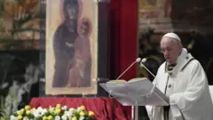 Pope Francis reads his "Urbi et Orbi" ("To the City and the World") message in St. Peter's Basilica