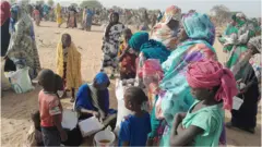لاجئة سودانية حامل فرت من العنف في بلدها