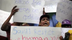 Signboard reads "cancel fraudulent fake agency licences"