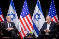 US President Joe Biden (L), sits with Israeli Prime Minister Benjamin Netanyahu, at the start of the Israeli war cabinet meeting, in Tel Aviv on October 18, 2023, amid the ongoing battles between Israel and the Palestinian group Hamas. US President Joe Biden landed in Tel Aviv on October 18, 2023 as Middle East anger flared after hundreds were killed when a rocket struck a hospital in war-torn Gaza, with Israel and the Palestinians quick to trade blame. (