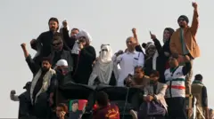 Bushra Bibi seen here on stage standing with leaders of Imran Khan's party during the latest protest in Pakistan.