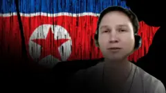 북한 인공기를 배경으로 노트북에 타이핑하는 사람의 실루엣. 앞에는 인공지능 기술로 얼굴을 변조한 남성의 모습이 있다.