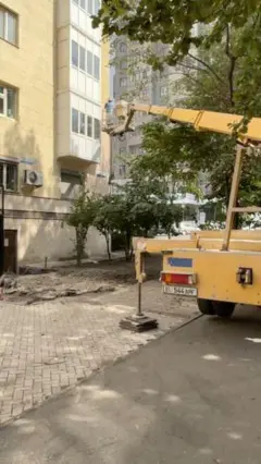 a crane lift with paint workers