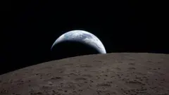 Earthset captured through the Orion spacecraft window