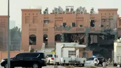 Screengrab of footage showing di building for Doha in di aftermath of strike