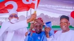 Bola Tinubu receive APC flag from President Buhari 