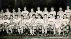 Caledonian and an Old Firm Select XI line up for a combined team photo before their match on 11 March 1959