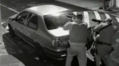 Reproduction from CCTV camera shows police officers in the city of Botucatu in a gunfight with bank robbers earlier this year