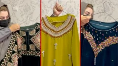 زنی سه لباس جدید افغانی به دست دارد.