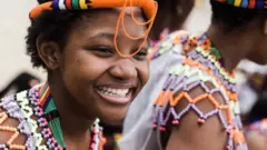 Women clad in their traditional Zulu outfits take part during the Indoni SA Cultural Festival on December 18, 2021 in Durban. - The Indoni festival, a three-day feast, showcases traditions of South African provinces and aims to demonstrate unity and the unique diversity of the country.