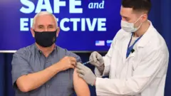 Pence receives the jab