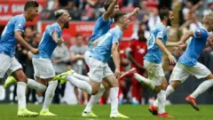 Wachezaji wa Manchester City washerehekea ushindi wao baada ya kuilaza Liverpool Charity Shield