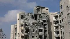A damaged residential building following a missile strike in Beersheba, Israel