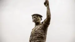A close shot of the second bronze statue of Burkina Faso's former President Thomas Sankara.