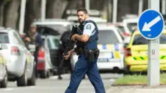 Armed police patrolled the streets following the shooting at the Al Noor mosque