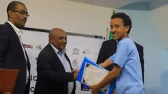 ሃምዛ ሃሚድ በውድድሩ ጊዜ አሸናፊ በሆነበት ጊዜ የተነሳው ፎቶ